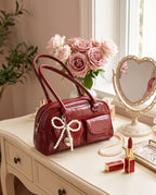 The Bow Charm Shoulder Bag — Cherry